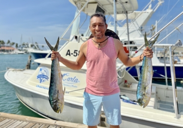 Renowned Indroh Kelkboom fishing with Carla Charters in Aruba, showing off his latest catch