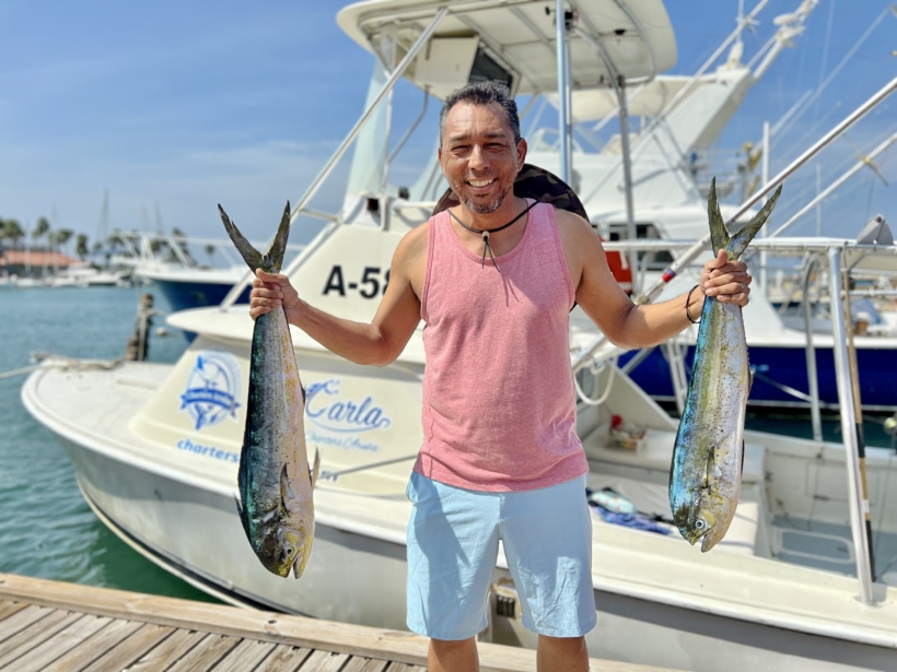 Renowned Indroh Kelkboom fishing with Carla Charters in Aruba, showing off his latest catch. excursion Aruba fishing