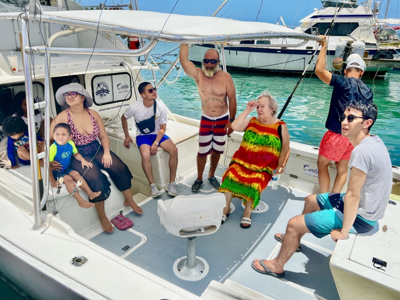 Family enjoying a fishing trip on a boat in Aruba with Carla Charters. fishing trips in aruba